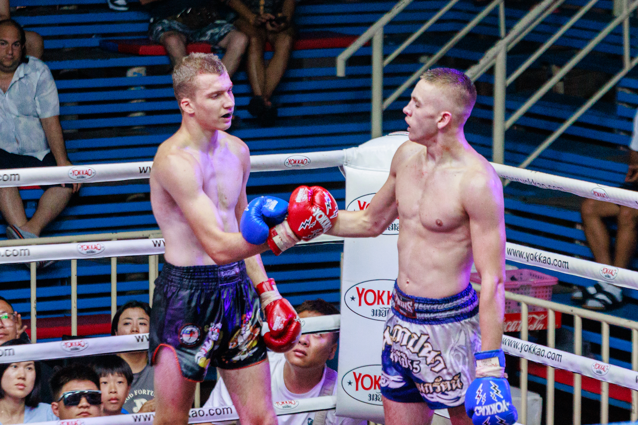 Muay Thai fighters bump their knuckles at Bangla Stadium