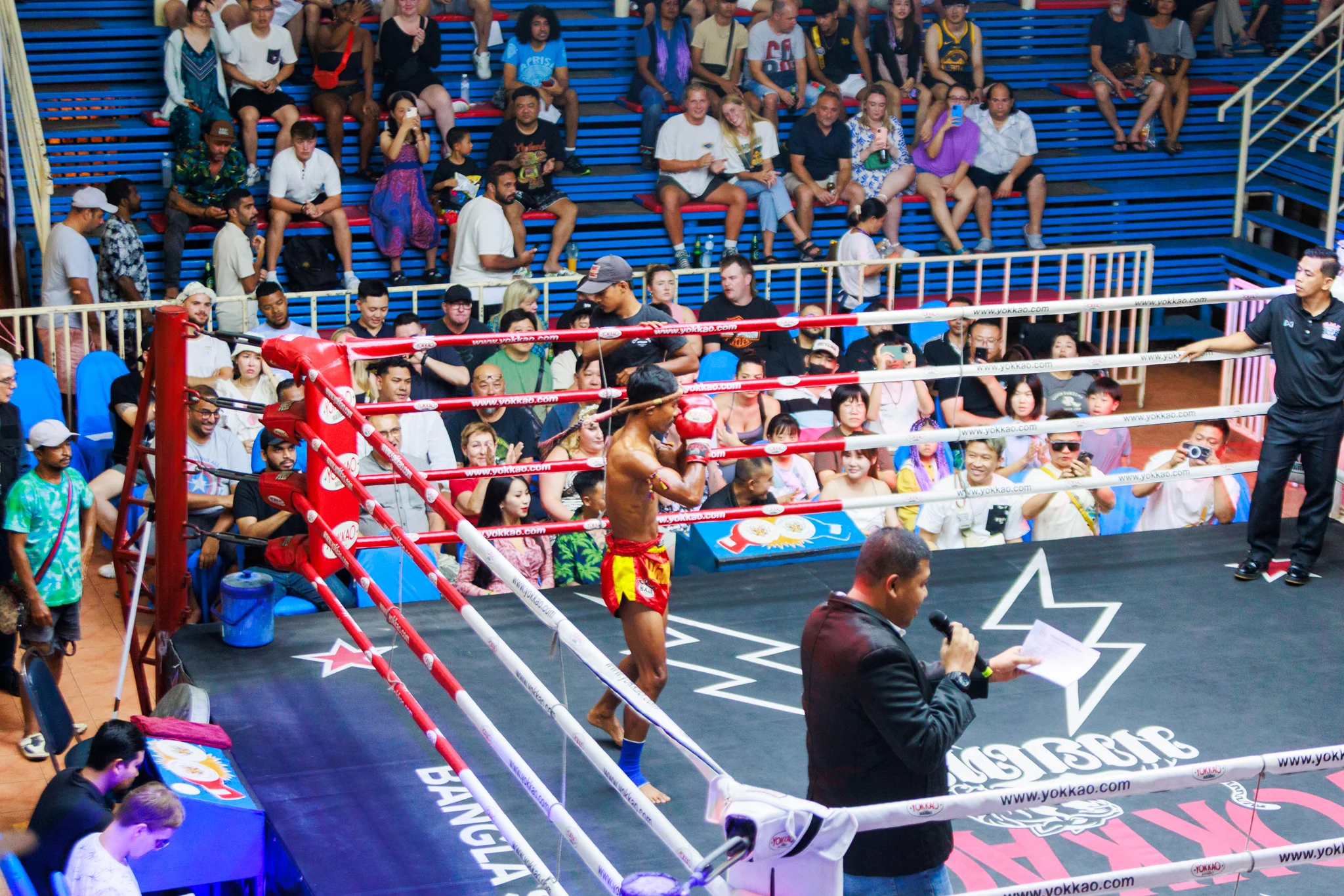 A-Thai-boxing-match-in-a-ring-with-spectators-watching