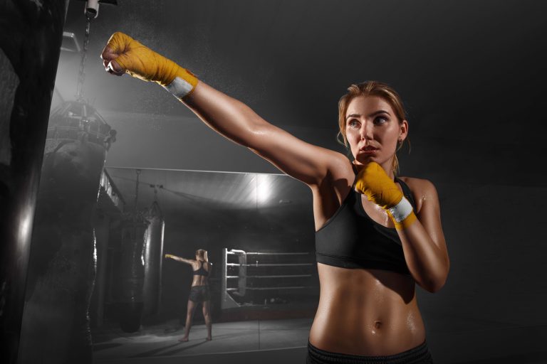 Girl Thai boxer training at the gym