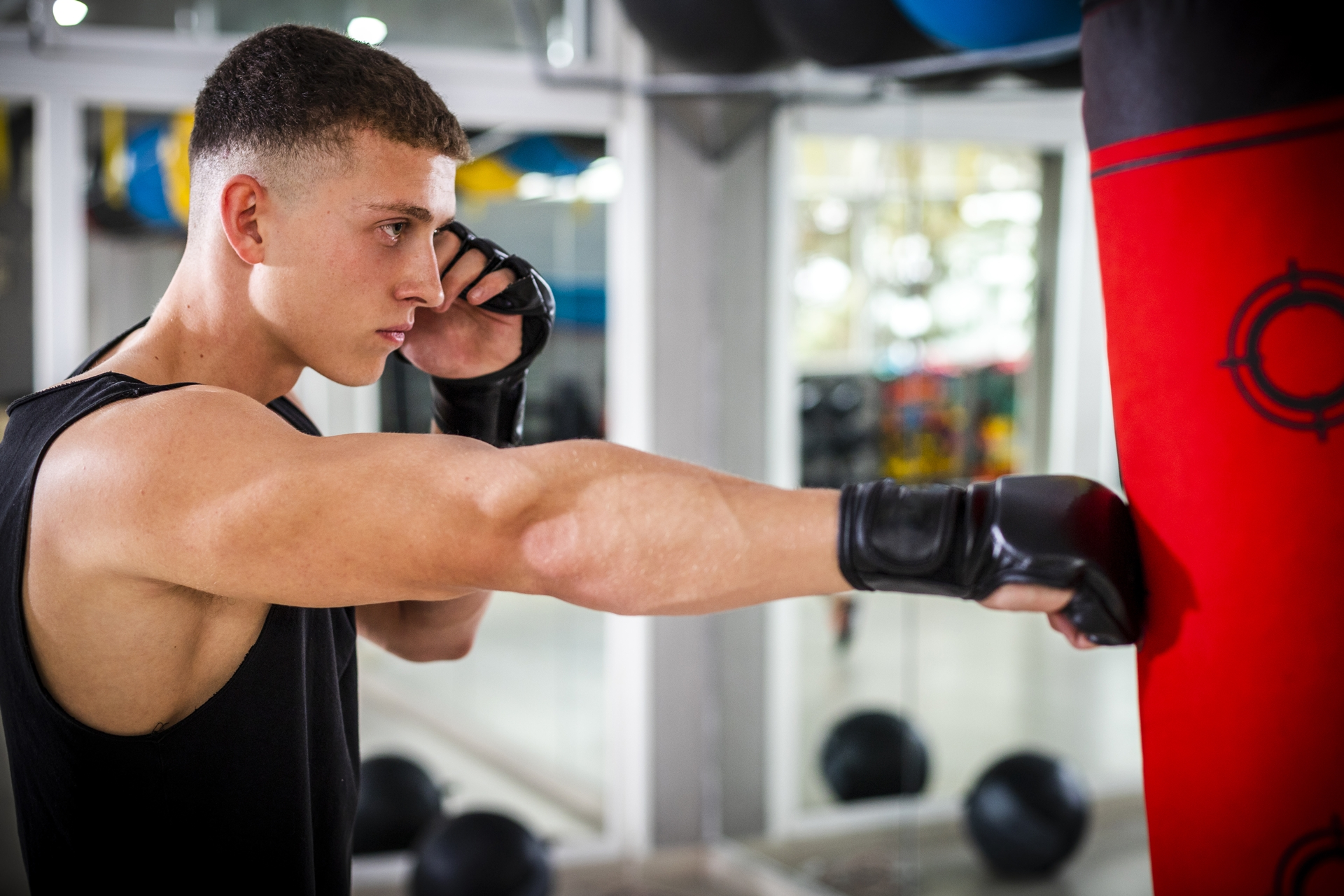 man training with punching bag
