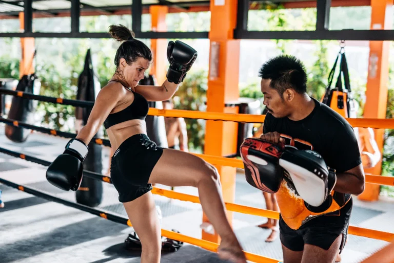 boxing gloves hanging ring ropes