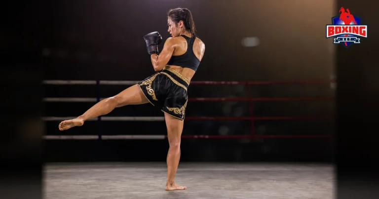 Female Muay Thai fighter extending a controlled kick in a side-rear view